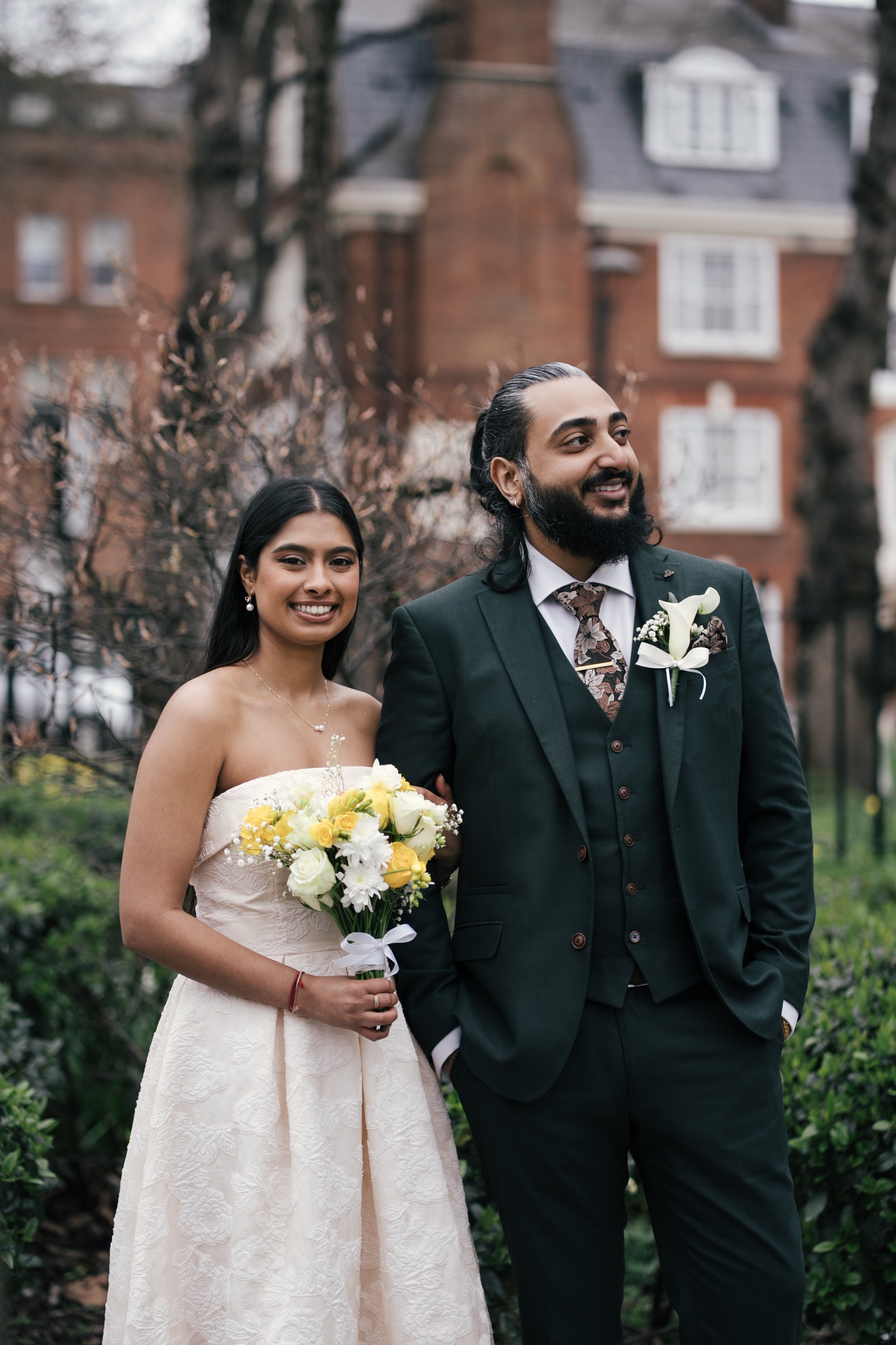 A newly married couple in a garden